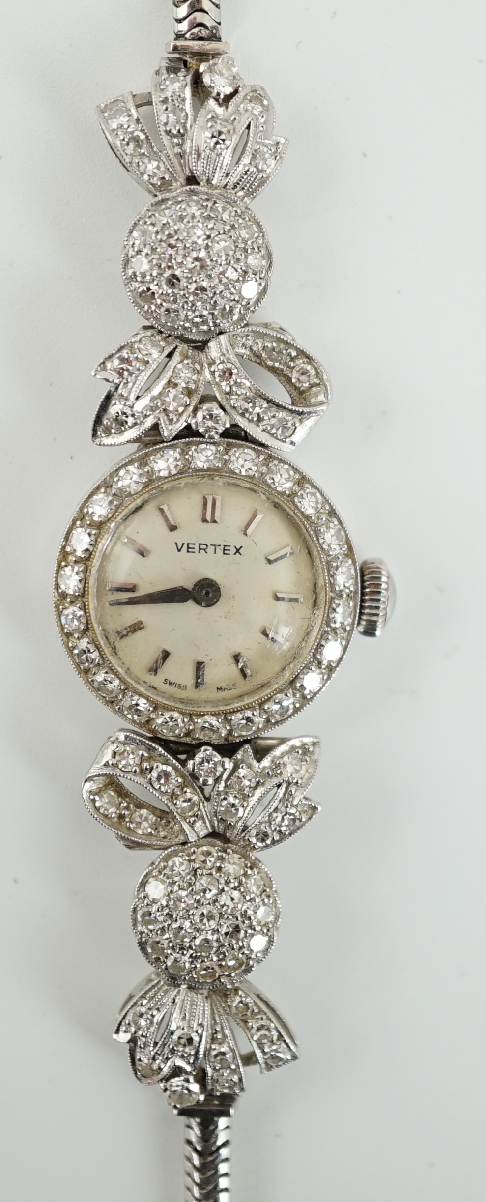 A lady's mid 20th century platinum and round cut diamond set Vertex manual wind cocktail watch